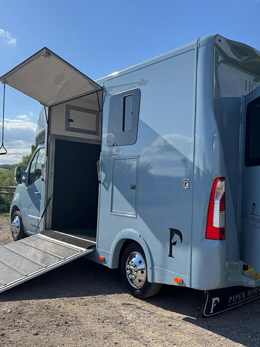 Rear view of Piper Horseboxes Ltd vehicle showing company branding.