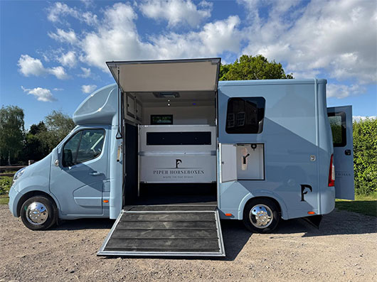 Group preparing for travel with their Piper Horseboxes Ltd vehicle.