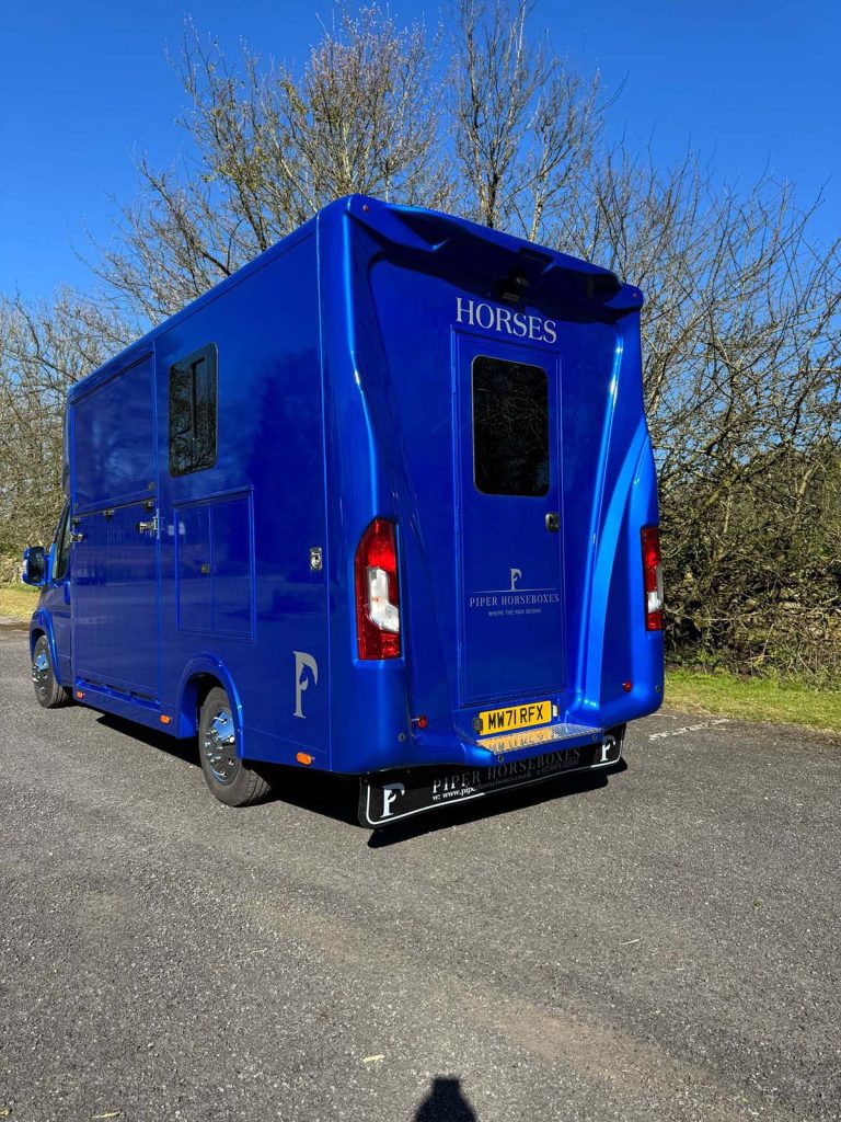 Reinforced doors and safety latches by Piper Horseboxes Ltd for safe travel.