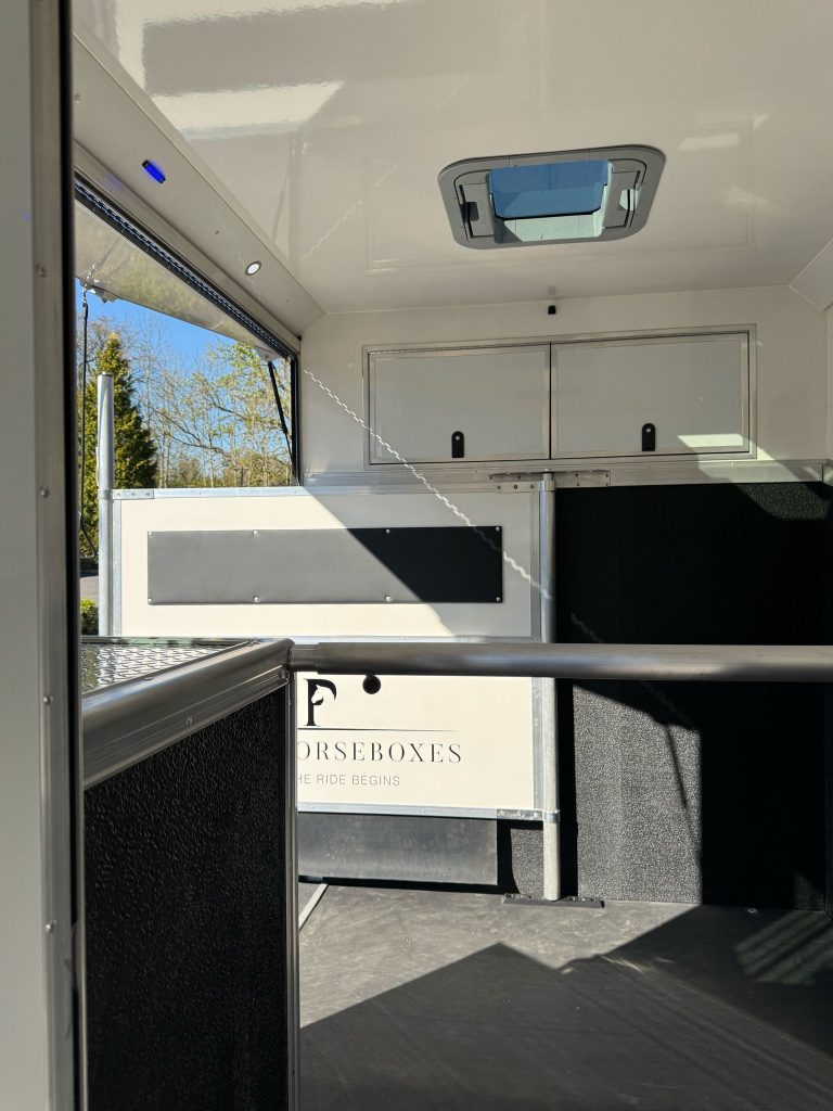 Reinforced bars and safety latches by Piper Horseboxes Ltd for safe travel.