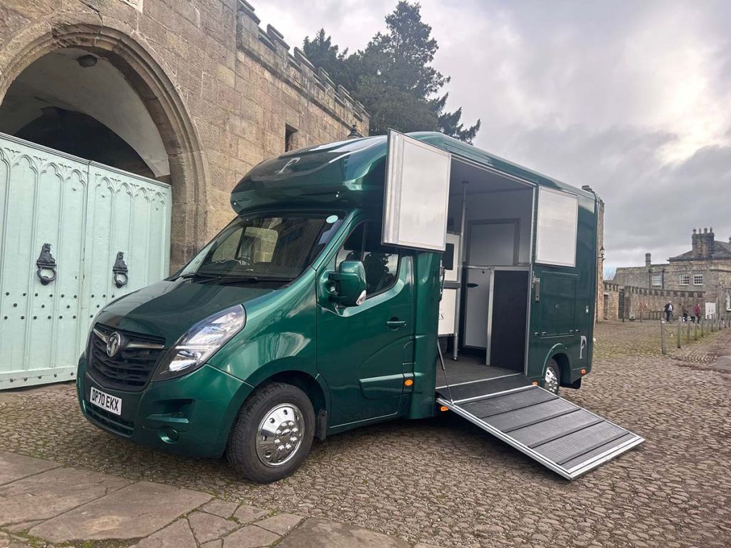 Racing green horsebox with side ramp open