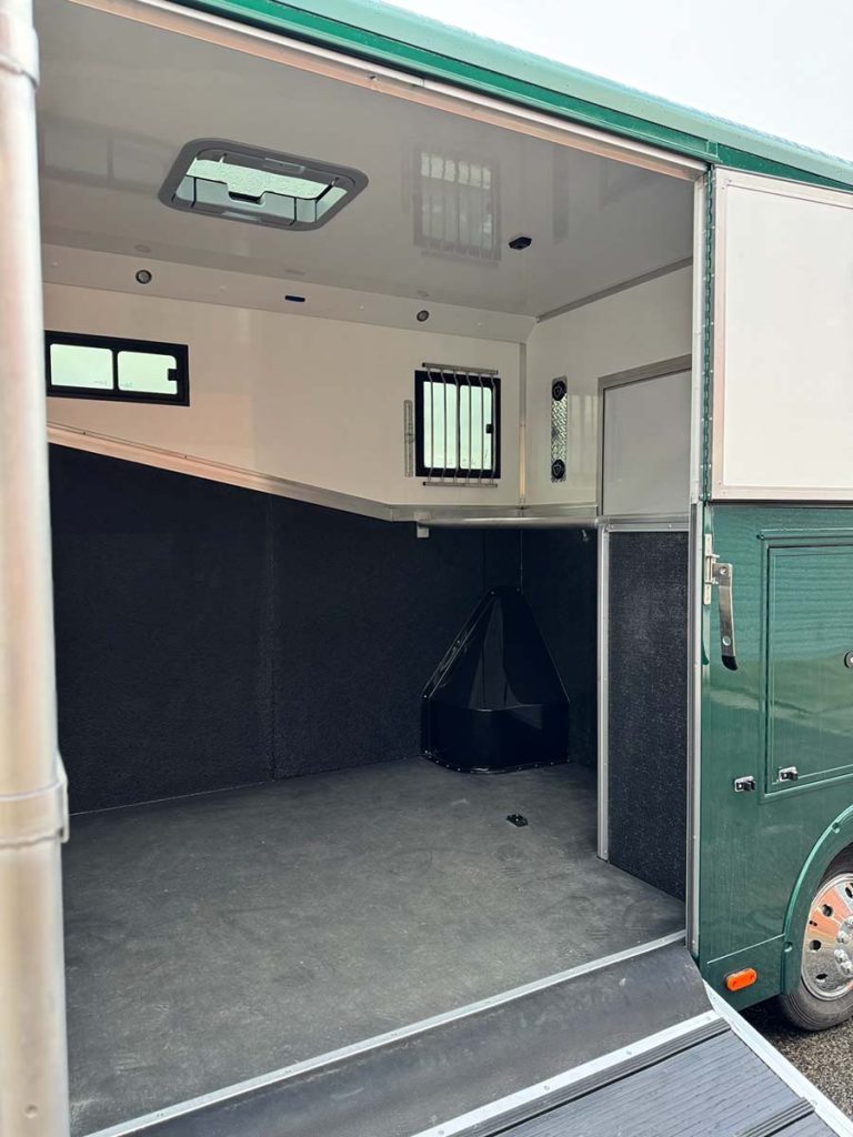 Close up of racing green horsebox with ramp down