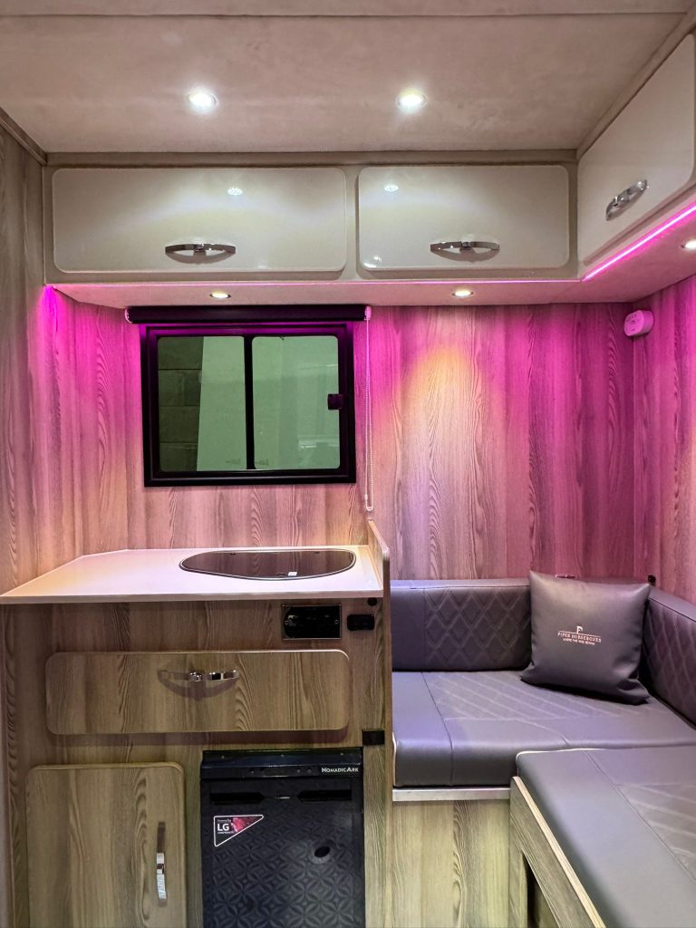 Pink LED lighting at kitchen area Piper Horseboxes Ltd luxury horsebox. Perfect for equestrian travel.