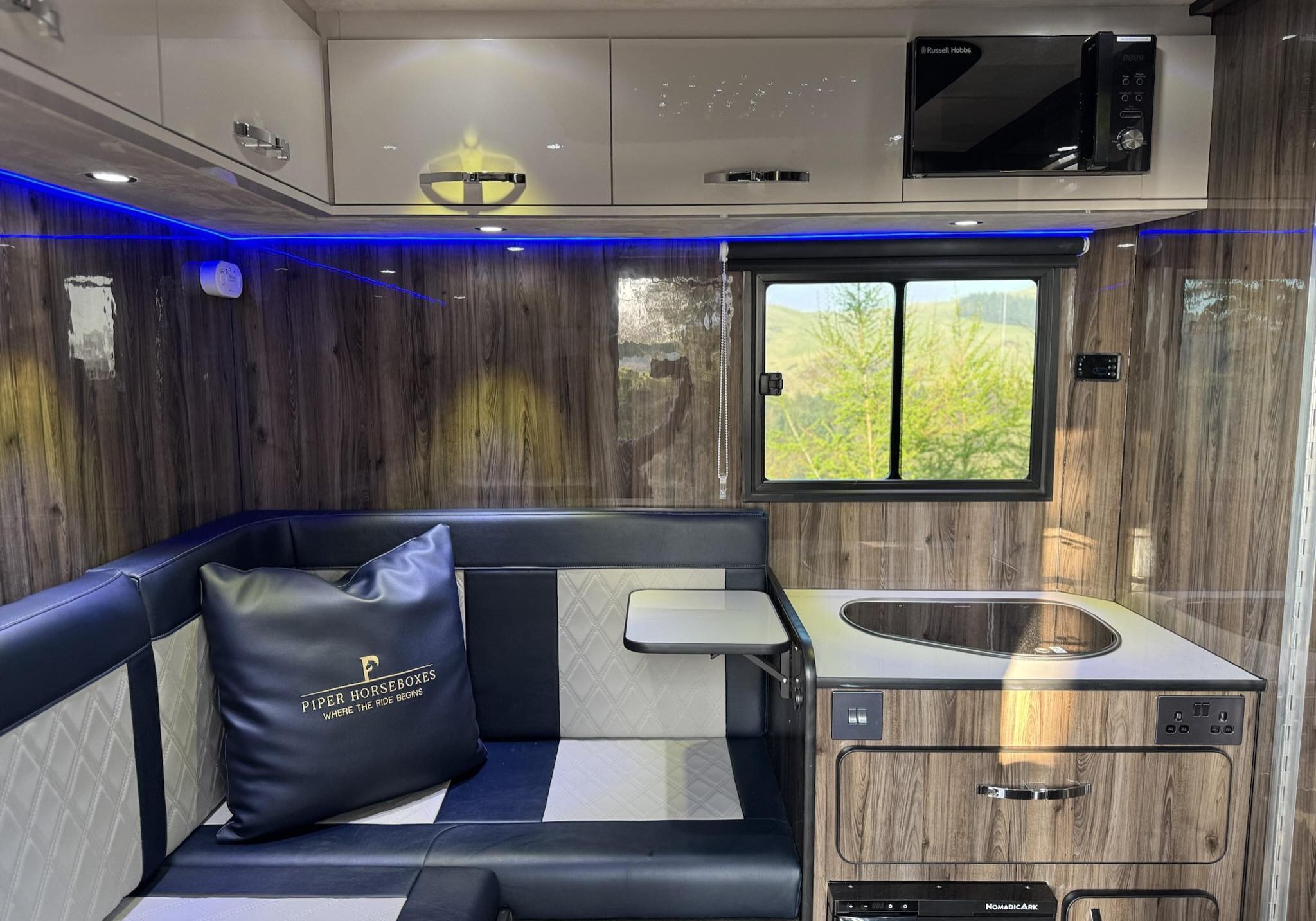 Luxury living space inside a Piper Horseboxes Ltd horsebox with modern finishes.