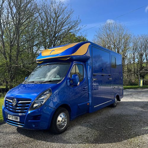 Front view of a blue and gold Piper Horseboxes Ltd horsebox in Lancashire. Perfect for horse shows and travel.