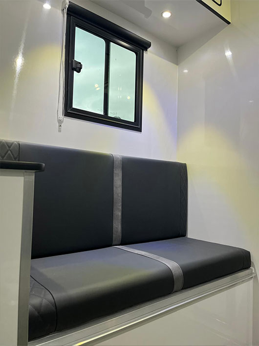 Luxury living space inside a Piper Horseboxes Ltd horsebox with modern finishes. Perfect for equestrian travel.