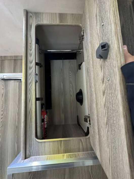 Storage compartment with lock in horsebox