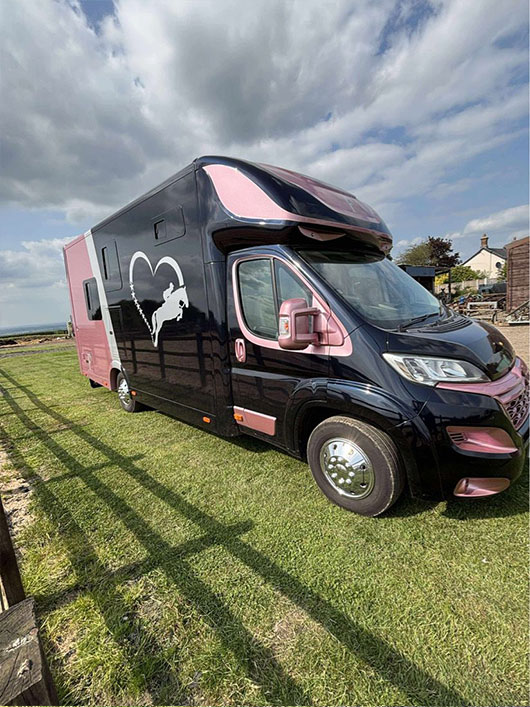 Riders with their Piper Horseboxes Ltd vehicle after competition.