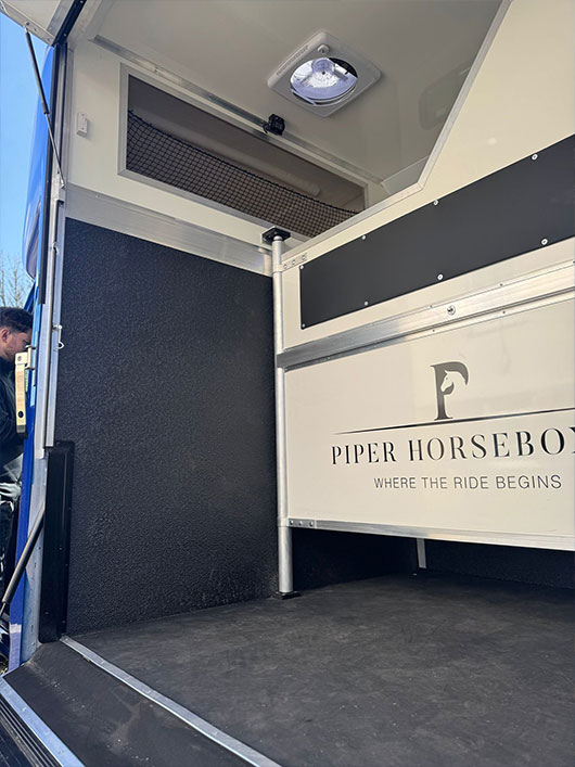 Integrated storage solution in a Piper Horseboxes Ltd horse transport vehicle. Perfect for equestrian travel.
